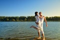 Man and woman on a pier on sunset Royalty Free Stock Photo