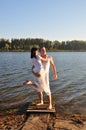 Man and woman on a pier on sunset Royalty Free Stock Photo