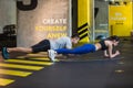 Man and woman are planking in fitness center Royalty Free Stock Photo