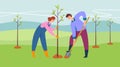 A man and a woman plant a tree, spring work