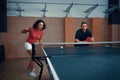 Man and woman play doubles table tennis, ping pong Royalty Free Stock Photo