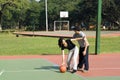 Man and Woman Playing Basketball - Horizontal Royalty Free Stock Photo