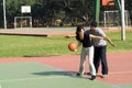 Man and Woman Playing Basketball - Horizontal Royalty Free Stock Photo