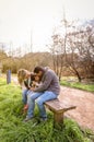 Man and woman playing with little girl sitting on Royalty Free Stock Photo