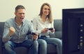 Man and woman playing video game Royalty Free Stock Photo