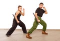 Man and woman practce with truncheon