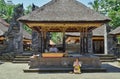 Man and woman praying in Gunung Kawi temple complex.