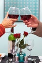 Man and woman raising glasses of wine Royalty Free Stock Photo