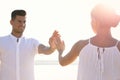 Man and woman reaching hands to each other near river. Nature healing power