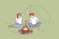 Man and woman relaxing near campfire