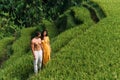 A man and a woman among the rice terraces. A couple in love is traveling in Asia. A man and a woman are traveling in Indonesia. Royalty Free Stock Photo