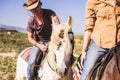 Man and woman ride two horses outdor for freedom feeling Royalty Free Stock Photo