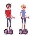 Man and woman riding black electric scooters