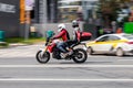 Man and woman riding on BMW F 900 R motorcycle. Young couple riding motorbike on city road Royalty Free Stock Photo