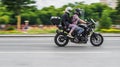 Man and woman riding on bmw f800r motorcycle. Young couple riding motorbike on city road Royalty Free Stock Photo