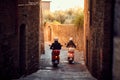 Man and woman riding motor scooter on city.Bikers on the road Royalty Free Stock Photo