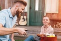 Man and woman roasting meat and vegetables Royalty Free Stock Photo