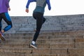 Man and woman run on the stairs Royalty Free Stock Photo