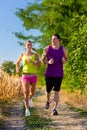 Man and woman running for sport