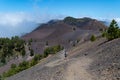 Man and woman running on volcanic trail, La Palma, Spain Royalty Free Stock Photo