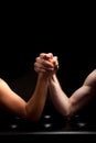 Arm wreslting man woman black background Royalty Free Stock Photo