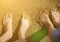 Man and woman`s feet in the water. Romantic summer photo at the beach. Holiday concept. Travel to the sea. Warm ocean. Toes in Royalty Free Stock Photo