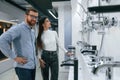 Man and woman is in sanitary ware store choosing products Royalty Free Stock Photo