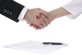 Man and woman shaking hands over a contract