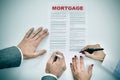 Man and woman signing a mortgage loan contract