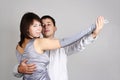 Man and woman in silver dress dancing waltz