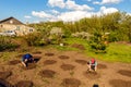 A man and a woman sitting in the garden plant melons and watermelon Royalty Free Stock Photo