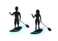 Man and woman stand up paddling