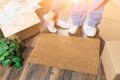 Man and Woman Standing Near Home Sweet Home Welcome Mat, Moving Royalty Free Stock Photo