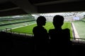 Man and woman standing and talking on stadium Royalty Free Stock Photo