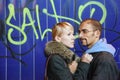 Man and woman is staying near graffiti wall Royalty Free Stock Photo