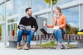 Man and woman student chatting on university campus Royalty Free Stock Photo