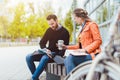 Man and woman student chatting on university campus Royalty Free Stock Photo