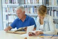 man and woman studying in library Royalty Free Stock Photo