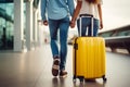 A young loving couple of tourists waiting for a plane flight. Man and woman with suitcases at the airport. Concept: travel, Royalty Free Stock Photo