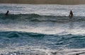 Man and Woman Waiting to Surf a Wave