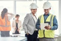 Man, woman and tablet in office for architecture analysis, construction teamwork or vision. Architect team, contractor Royalty Free Stock Photo