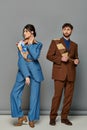 man and woman in tailored suits