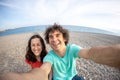 A man and a woman take a selfie on the seashore Royalty Free Stock Photo