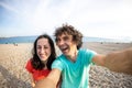 A man and a woman take a selfie on the seashore Royalty Free Stock Photo