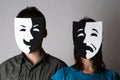 Man and woman in theatre emotions masks