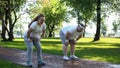 Man and woman tired after jogging in park, fitness weight loss program, cardio Royalty Free Stock Photo