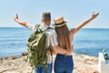 Man and woman tourist couple hugging each other on back view at seaside Royalty Free Stock Photo