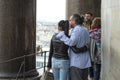 A man and a woman, tourists of European appearance look into the colonnade of St. Isaac`s Cathedral in St. Petersburg, Russia,