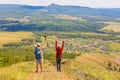 man and woman Tourists on a picnic on the ridge of the Ural Mountains