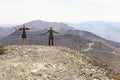 Man and woman tourists stand on the top of Poklonnaya Gora against the background of Mount Karabash on a summer day. Chelyabinsk r Royalty Free Stock Photo